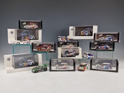 a lot of different model cars on display in a display case