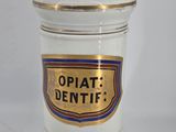 an image of a white and gold container with a sign on it