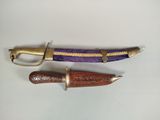 two different types of knives on a white surface