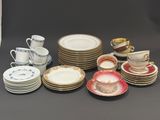 a lot of plates and cups on the table