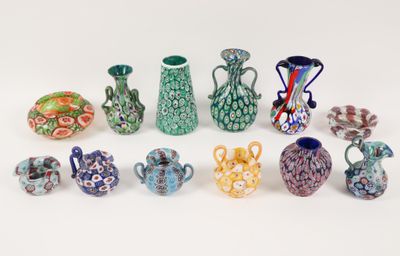 a lot of vases that are sitting on a table
