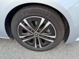 a close up of a tire on a white car