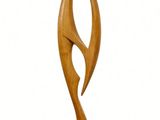 wooden sculpture of an abstract shape on a wooden base