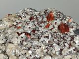 a close up of a piece of rock with small crystals on top of it