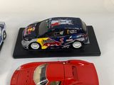 three toy cars that are on display on a table