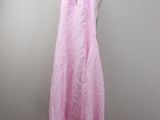 a picture of a pink dress hanging on a hanger