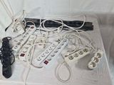 a lot of cords and remote controls on a table