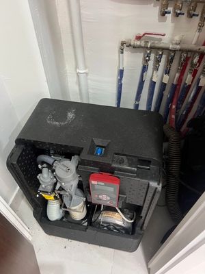 a black box with a water pump inside of it