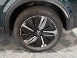 a close up view of a car ' s wheel on the ground