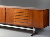 the sideboard is made of wood and has four drawers on each side
