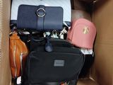 a box full of purses and handbags that are in it
