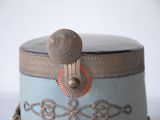 a small blue box with a decorative design on it