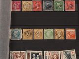 several different types of stamps are displayed in a display case
