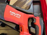 a red box with a saw and a tool in it