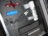 a picture of a drawer with tools and a pair of scissors