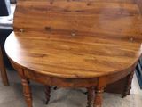 a wooden table with a wooden top on a floor