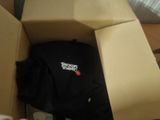 a box that has a shirt in it on top of it