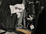 a black suitcase with a bunch of items inside of it
