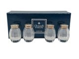 three glass salt and pepper shakers in a gift box