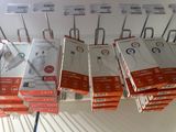 boxes of electronic gadgets on a rack in a store
