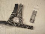 a plastic bag and a pair of scissors on a bed