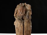 an image of a wooden sculpture of a man and a woman