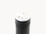 a close up of a bottle of wine on a table