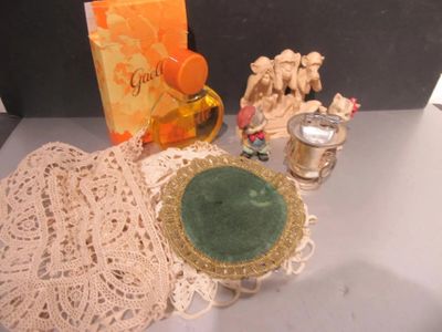 a lot of doily on a table with a candle and a plate