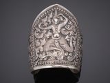 an old silver ring with a lion on it ' s side