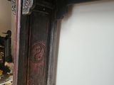 a fire place in the corner of a room with a fire place