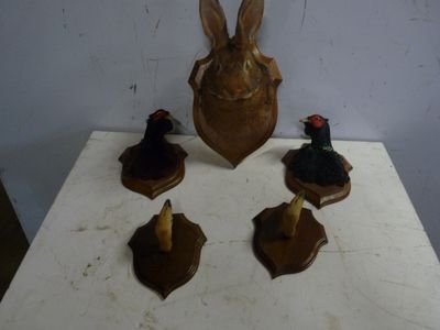a table with a bunch of wooden animals on top of it