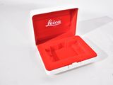 a red and white box that has a watch inside of it