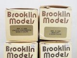 three boxes of brown and white milk sitting on top of each other