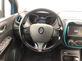 the interior of a car with a steering wheel and dashboard controls