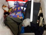 a white bag filled with various items and a stuffed animal