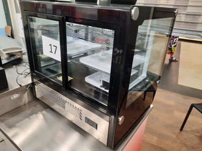 a display case with a lot of food inside of it