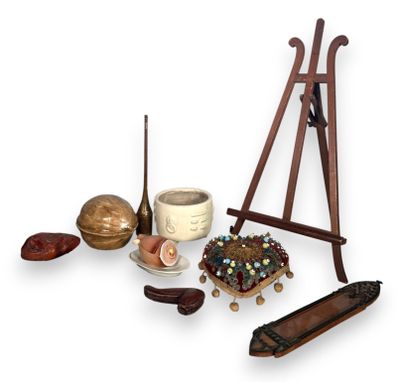 an image of a collection of objects including an easel, a bowl, a candle, and a candle holder
