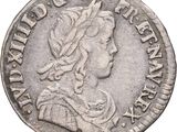 gros plan d'une pièce de monnaie sur laquelle figure une tête de femme