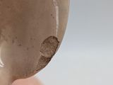 a close up of a statue of a man with a face