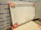a white radiator sitting on the floor next to a wall