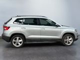 a picture of a silver suv parked in a garage