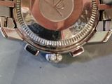 a close up of a wrist watch on a table