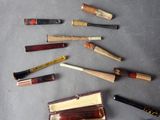 a lot of different types of baseball bats on the table