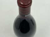 a bottle of wine that is sitting on a table