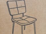 a cardboard box with a picture of a chair in it