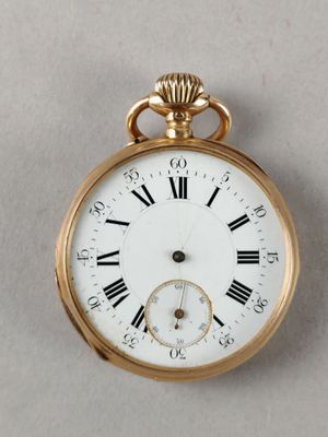 a gold pocket watch with roman numerals on the face