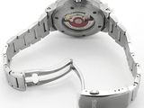 a watch that is sitting on a white surface