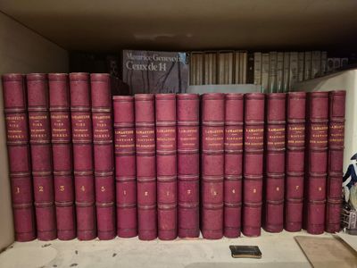 a lot of books that are sitting on a shelf