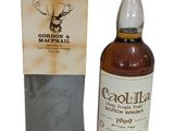 a bottle of caoliza scotch whisky next to a cardboard box