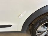 a white car with a sticker on the side of it